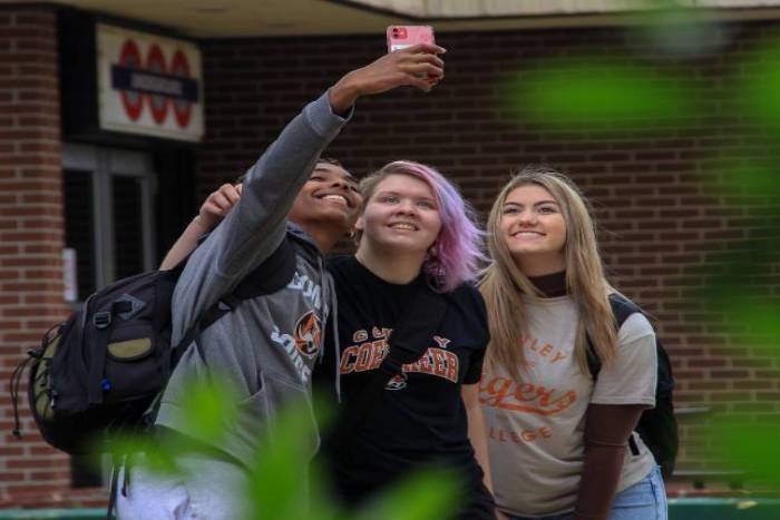 three students taking a selfie