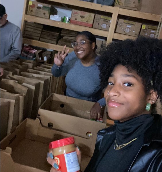 students assisting in a pantry. 