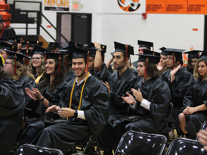 graduates at commencement