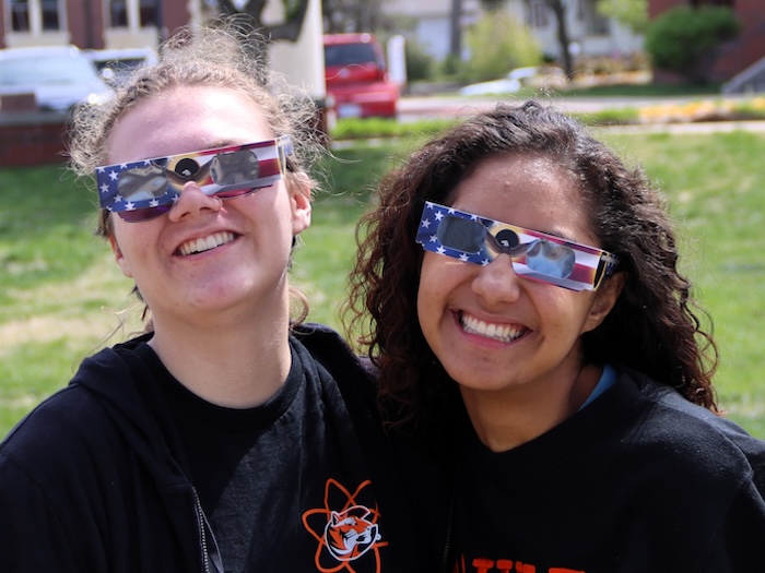 two girls enjoying the eclipse