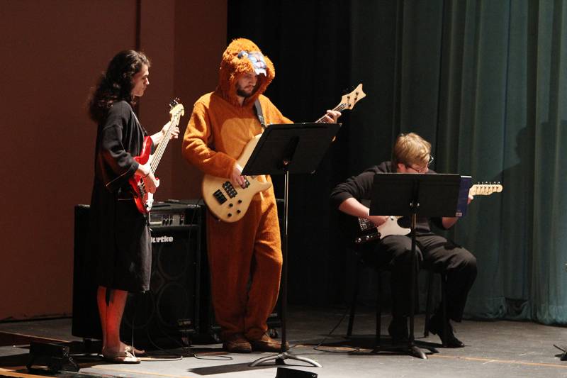 students in costume playing instruments