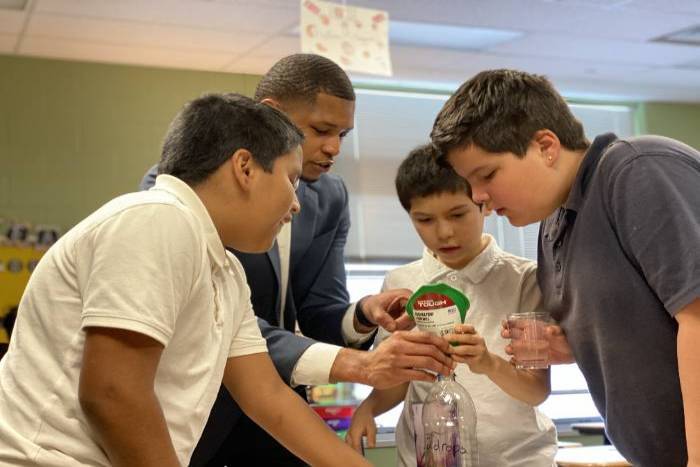 Students with teacher in a classroom