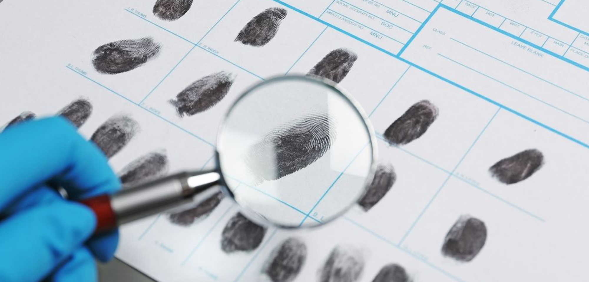 technician examining finger prints