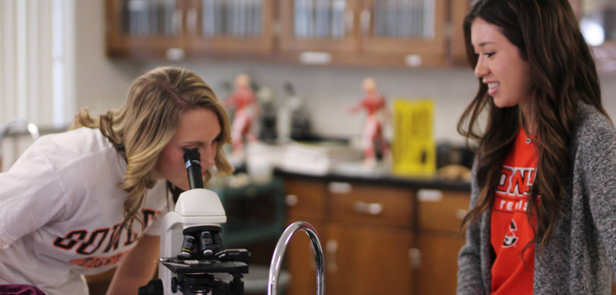 two students in a science lab