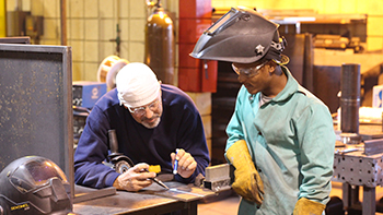 Welding Instructor with student 